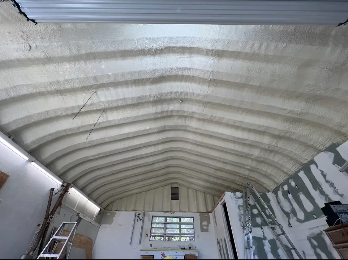 Spray polyurethane foam applied to the underside of a metal roof deck in East Hartford